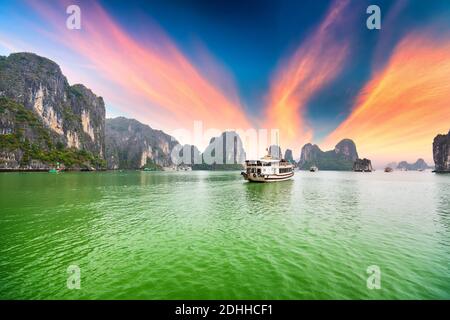 Dreamy sunset among the rocks of Halong Bay, Vietnam, This is the UNESCO World Heritage Site, it is a beautiful natural wonder in northern Vietnam Stock Photo