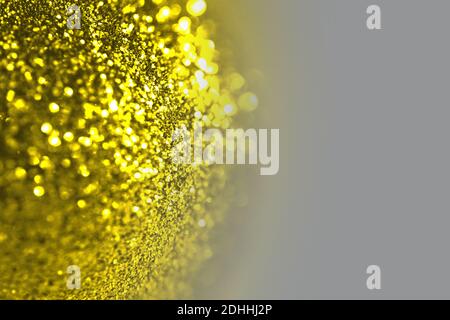 Abstract Natale vacanza illuminando giallo lucido sfondo con glitter e. gradiente grigio Foto Stock