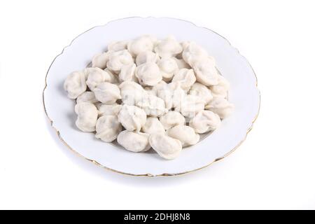 gnocchi in una piastra bianca isolata su bianco Foto Stock