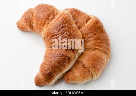 Croissant e eine Tasse Kaffee zum Fruehstueck Foto Stock