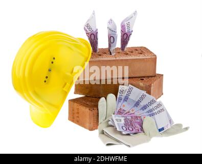 Hausbau Symbolfoto, Finanzierung, Bausparen. Ziegel und Euro Foto Stock