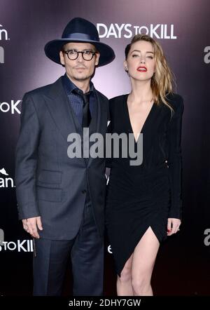 File photo : Johnny Depp e Amber Heard partecipano alla prima di '3 Days to Kill' all'ARCLIGHT Cinemas di Los Angeles, CA, USA il 12 febbraio 2014. L'attore Johnny Depp e sua moglie Amber sentito divorziare dopo 15 mesi di matrimonio. Amber, 30, ha citato le differenze inconciliabili e sta cercando il sostegno spousal dai Pirati della stella caraibica, secondo i documenti della corte. La coppia, che non hanno figli insieme, si è sposata nel febbraio dello scorso anno dopo aver co-interpretato il film del 2011 The Rum Diary. Foto di Lionel Hahn/ABACAPRESS.COM Foto Stock