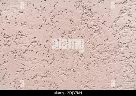 Parete beige con intonaco decorativo goffrato. Foto Stock