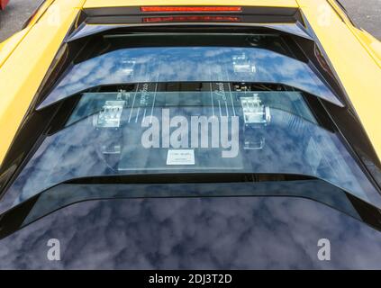 Close up detail of the engine cover and rear window of a yellow Lamborghini Murciélago LP 640 Stock Photo