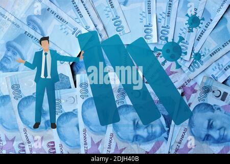 100 turkish lira banknote obverse decline graph indicating exchange rate with copyspace, A money bill looking like a declining graph with an downward Stock Photo