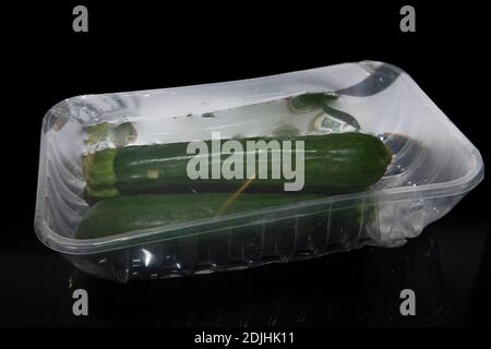Zucchini vegetable wrapped in plastic Foto Stock