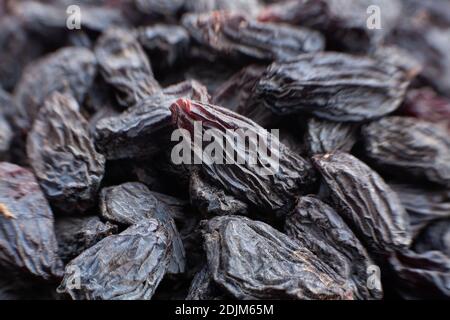 dettaglio macro uva passa nera primo piano Foto Stock