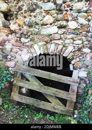 Entrance to an old wine cellar in South Tyrol blocked with wooden shed Stock Photo