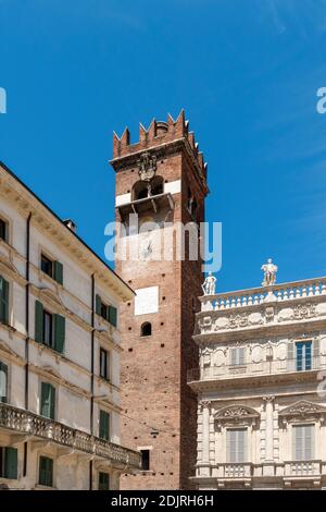 Verona, Province of Verona, Veneto, Italy. The Torre del Gardello and the Palazzo Maffei in the Piazza delle Erbe Stock Photo