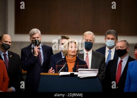 United States Senator Lisa Murkowski (Republican of Alaska) joins a bipartisan group of US Senators announcing the legislative text of the two bipartisan, bicameral COVID-19 emergency relief bills that propose to provide up to $908 billion in emergency relief on Capitol Hill in Washington, DC on Monday, December 14, 2020. The first will allocate $748 billion for more PPP assistance and an unemployment benefit; and a second $160 billion bill to provide aid for state and local governments and liability protections for businesses.Credit: Rod Lamkey/CNP | usage worldwide Stock Photo