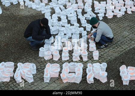 Brussels, Belgium. 14th Dec, 2020. Environmentalists work on an installation calling for the protection of forests outside the European Commission headquarters in Brussels, Belgium, on Dec. 14, 2020. Credit: Zheng Huansong/Xinhua/Alamy Live News Stock Photo