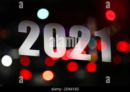 Brussels, Belgium. 14th Dec, 2020. This multiple exposed photo shows a sign of 2021 illuminated on a building in Brussels, Belgium, Dec. 14, 2020. Credit: Zheng Huansong/Xinhua/Alamy Live News Stock Photo