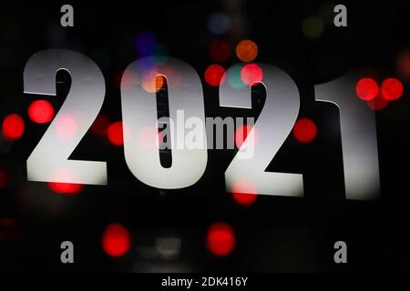 Brussels, Belgium. 14th Dec, 2020. This multiple exposed photo shows a sign of 2021 illuminated on a building in Brussels, Belgium, Dec. 14, 2020. Credit: Zheng Huansong/Xinhua/Alamy Live News Stock Photo