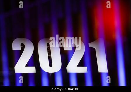 Brussels, Belgium. 14th Dec, 2020. This multiple exposed photo shows a sign of 2021 illuminated on a building in Brussels, Belgium, Dec. 14, 2020. Credit: Zheng Huansong/Xinhua/Alamy Live News Stock Photo