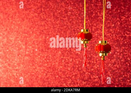 Little lantern decoration for  Chinese new year festival on red background Foto Stock