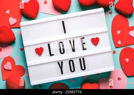 Happy Valentine's Day.Lightbox with the word i love you and red hearts on a blue background.Valentine day concept Stock Photo