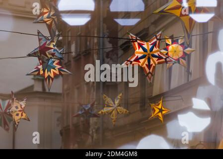 Lublin, Poland - December 29, 2019: Colorful illuminated stars as Christmas decorations at Złota Street in old town Stock Photo