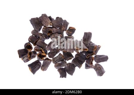 Dried vegetables on white table. Dried peppers, aubergines (eggplants) and courgettes (zucchinis) hanging in a food store. Stock Photo