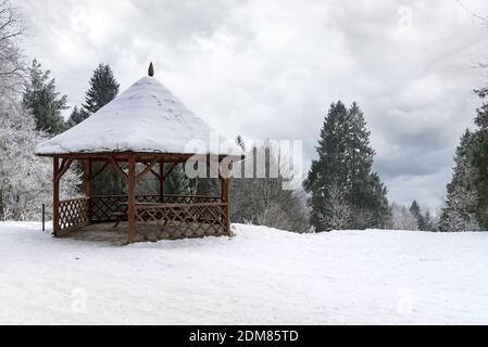 Wooden bower on Parkowa Mountain in Krynica Zdroj on a clody winter day Stock Photo