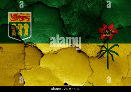 Bandiera di Saskatchewan dipinto su parete fessurata Foto Stock