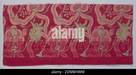 Textile, Medium: silk, metallic threads Technique: 4&1 satin damask with discontinuous supplementary weft patterning (brocade), Length of red silk damask brocaded with silver and yellow/green silk. Both the damask design and the brocade design show sinuous curving elements and exotic blossoms., Italy or Northern Europe, 1650–1700, woven textiles, Textile Stock Photo