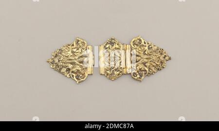 Book clasp, Gilt silver, Two hinged parts of triangular clasp, relief decorated with scroll and openwork and putto head with wings; single piece identical to hinged part., probably Italy, probably 17th century, metalwork, Decorative Arts, Book clasp Stock Photo