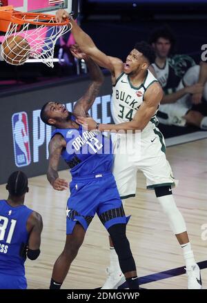 NO FILM, NO VIDEO, NO TV, NO DOCUMENTARY - File photo dated August 20, 2020 of the Milwaukee Bucks' Giannis Antetokounmpo (34) dunks over the Orlando Magic's Gary Clark (12) during Game 2 of the Eastern Conference First Round playoff series at Disney's ESPN Wide World of Sports in Orlando, FL, USA. Milwaukee Bucks star Giannis Antetokounmpo has signed a contract extension worth a reported $228.2m - the richest in NBA history. The two-time Most Valuable Player, 26, has agreed a five-year deal. Photo by Stephen M. Dowell/Orlando Sentinel/TNS/ABACAPRESS.COM Stock Photo