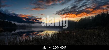 Winter Sunset panorama format photo of Cheam Lake Wetlands Regional Park with the Mount Cheam in the background, Rosedale, British Columbia, Canada Stock Photo