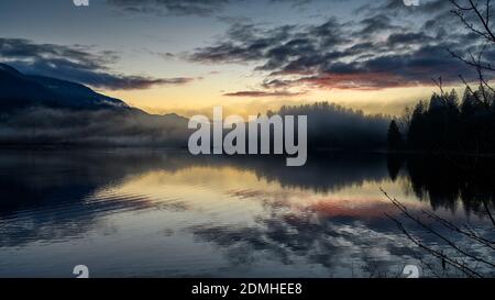 Winter Sunset panorama format photo of Cheam Lake Wetlands Regional Park with the Mount Cheam in the background, Rosedale, British Columbia, Canada Stock Photo