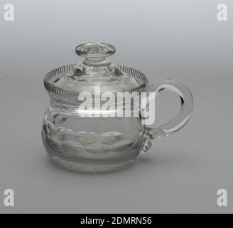 Jar and cover, glass, Round body with vertical fluted rim at top; loop handle; high domed lid with button finial and notch cut out for spoon; body and lid cut with double band of printies, a row of narrow flutes at base of body., Ireland, ca. 1800, glasswares, Decorative Arts, Jar and cover Stock Photo