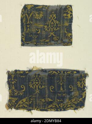 Fragments, Medium: silk Technique: two interconnected structures of 5-harness satin (blue) plus 1/2 twill (yellow), Fragments of woven fabric which was probably patterned by two offset interlocked rows of vertically symmetrical ogee – the same ogee in each row. The ogee is formed by leaves ending in a leaf finial at the top and a leaf pendant at bottom. The ogee encloses a floral motif., Egypt, Italy, 15th century, woven textiles, Fragments Stock Photo