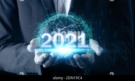 2021 futuristic technology concept man hand holding earth with global network communication technology including earth 2021 of energy for envirionment Stock Photo