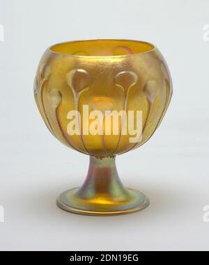 Vase, Tiffany Glass and Decorating Company, American, 1892 - 1900, Mold-blown favrile glass, One of a pair of amber vases. Flat base with a flaring stem. Squat bowl with all-around decoration of growing lily plants, New York, NY, USA, ca. 1900, glasswares, Decorative Arts, Vase Stock Photo