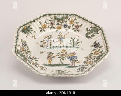 Plate, Tin-glazed earthenware, Octagonal form with fluted rim with thick dark green border; center decorated with three Callot-style figures and foliage in green and ochre on white ground., Moustiers-Sainte Marie, France, ca. 1763, ceramics, Decorative Arts, Plate Stock Photo