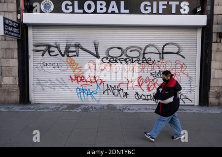 Shutters are down on this souvenir shop on Oxford Street as Londoners await the imminent end of the second coronavirus national lockdown before the capital enters tier two in the new three tier system on 1st December 2020 in London, United Kingdom. Non essential shops will be allowed to reopen as of 2nd December while in other areas of the country, controversially, they will have to remain closed. Stock Photo