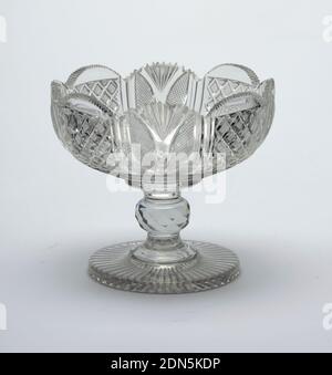 Bowl, Glass, Shallow round bowl cut with alternate panels of strawberry diamonds and panels with fan cutting and tiny diamonds, top edge scalloped; tall stem with round faceted knop, flat circular base with radial cutting on bottom; glass has greyish case, heavy., England, 19th century, glasswares, Decorative Arts, Bowl Stock Photo