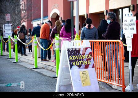 Marietta, GA, USA. 17th Dec, 2020. Residents in Cobb County, Georgia brave cold weather and long waits to cast in-person ballots as early voting opened this week for the January 5, 2021 special election for two senators. With three weeks left before polls close in two U.S. Senate runoff elections in Georgia that will determine the balance of power in Washington, a record number of early voters cast their ballots in person in multiple counties, according to reports. Following close races in November, Democrats Raphael Warnock and Jon Ossoff are hoping they unseat incumbent Republican Sens. Stock Photo