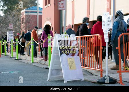 Marietta, GA, USA. 17th Dec, 2020. Residents in Cobb County, Georgia brave cold weather and long waits to cast in-person ballots as early voting opened this week for the January 5, 2021 special election for two senators. With three weeks left before polls close in two U.S. Senate runoff elections in Georgia that will determine the balance of power in Washington, a record number of early voters cast their ballots in person in multiple counties, according to reports. Following close races in November, Democrats Raphael Warnock and Jon Ossoff are hoping they unseat incumbent Republican Sens. Stock Photo