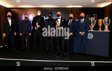 MUNICH, GERMANY - DECEMBER 17: FIFA president Gianni Infantino, Joshua Kimmich, goalkeeper Manuel Neuer, Alphonso Davies, Robert Lewandowski, team coach Hansi Flick and CEO Karl-Heinz Rummenigge (LR) of FC Bayern Munich pose after the FIFA The BEST Awards ceremony on December 17, 2020 in Munich, Germany. Lewandowski was awarded as FIFA World Player 2020, Neuer was awarded as FIFA World Goalkeeper 2020, and Kimmich and Davies were awarded as part of the FIFA FIFPro Men's World11 on Thursday. Photo by Pool/Marco Donato-FC Bayern/Pool/Getty Images via SVEN SIMON Fotoagentur GmbH & Co. Press Stock Photo