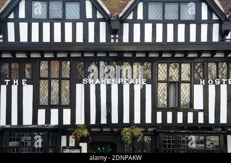 Window Patterns of Medieval Half-Timber Building or Post-and-beam Construction of The Shakespeare Hotel in Stratford-upon-Avon England Stock Photo