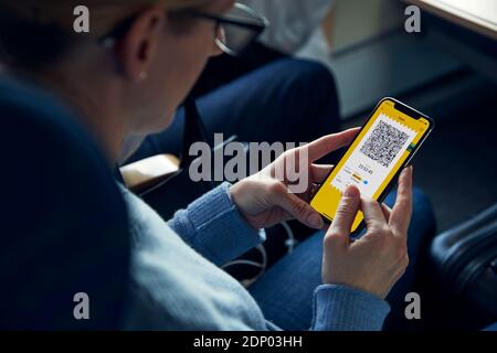 Woman holding cell phone with e-ticket Stock Photo