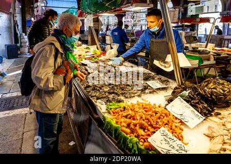 Local People Buying Fresh Seafood From The Fish Market, Venice, Italy. Stock Photo