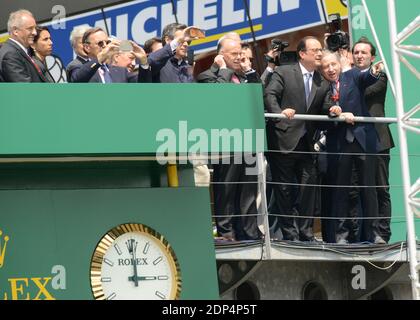 French President Francois Hollande with Pierre Fillon , France's President of the Automobile Club de l’Ouest (ACO), in charge of the organisation of the Le Mans 24-hours endurance race and France's FIA President Jean Todt watching the start of the Le Mans 24-hours endurance race in Le Mans, western France, on June 13, 2015. Photo by Guy Durand/ABACAPRESS.COM Stock Photo