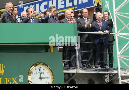 French President Francois Hollande with Pierre Fillon , France's President of the Automobile Club de l’Ouest (ACO), in charge of the organisation of the Le Mans 24-hours endurance race and France's FIA President Jean Todt watching the start of the Le Mans 24-hours endurance race in Le Mans, western France, on June 13, 2015. Photo by Guy Durand/ABACAPRESS.COM Stock Photo