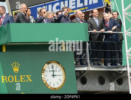 French President Francois Hollande with Pierre Fillon , France's President of the Automobile Club de l’Ouest (ACO), in charge of the organisation of the Le Mans 24-hours endurance race and France's FIA President Jean Todt watching the start of the Le Mans 24-hours endurance race in Le Mans, western France, on June 13, 2015. Photo by Guy Durand/ABACAPRESS.COM Stock Photo