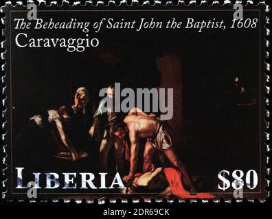 Decapitazione di San Giovanni Battista di Caravaggio sul francobollo Foto Stock