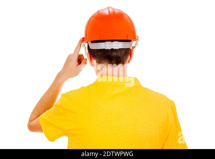 Vista posteriore uomo con casco rigido e dito sollevato Lo sfondo bianco Foto Stock