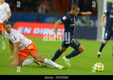 Lucas Moura di PSG ha combattuto contro Daniel Congre di Montpellier durante la prima partita di calcio della Francia, Parigi-St-Germain contro Montpellier, nello stadio Parc des Princes, Parigi, Francia, il 20 dicembre 2014. PSG e Montpellier hanno disegnato 0-0. Foto di Henri Szwarc/ABACAPRESS.COM Foto Stock