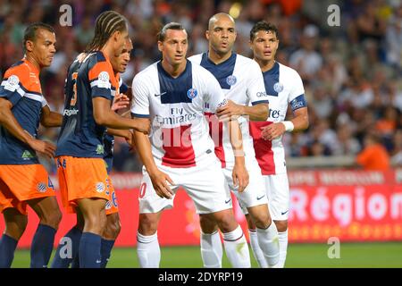 Daniel Congre di Montpellier ha combattuto Zlatan Ibrahimovic, Alex e Thiago Silva di PSG durante la prima partita di calcio della Lega francese, Montpellier contro Paris-St-Germain a Montpellier, Francia, il 9 agosto 2013. PSG e Montpellier hanno disegnato 1-1. Foto di Henri Szwarc/ABACAPRESS.COM Foto Stock