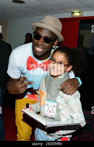 Moussier Tombola durante il ventesimo galà annuale di raccolta fondi 'Faire Face' per bambini malati, tenutosi all'Opera di Avignone, in Francia, il 12 ottobre 2013. Foto di Nicolas Briquet/ABACAPRESS.COM Foto Stock